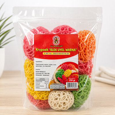 Packaged colorful noodles with a visible brand label on a light wooden surface.